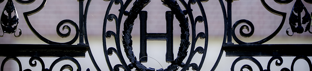 A closeup photo of the Harvard wrought iron gates
